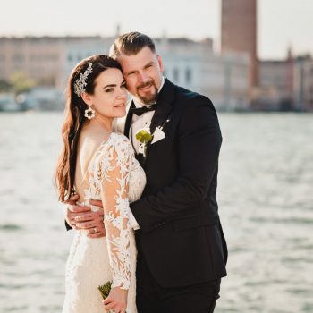 A couple during a symbolic wedding in Venice captured on a water taxi cruising along the Grand Canal.