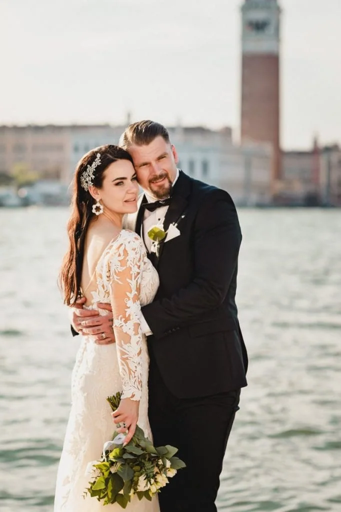 A couple during a symbolic wedding in Venice captured on a water taxi cruising along the Grand Canal.
