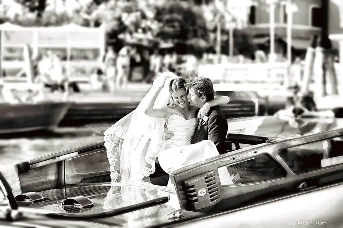 Romantic couple on gondola ride in Venice, wedding proposal photography, love story captured on water.