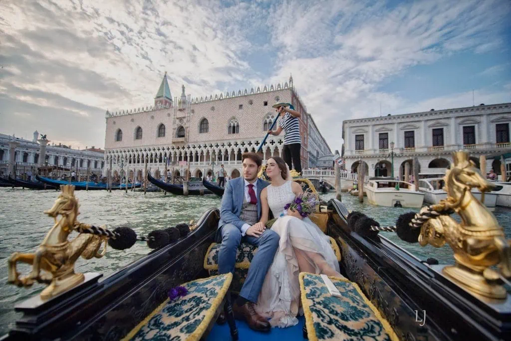 Engagement photos in Venice with a romantic gondola ride under the Bridge of Sighs.