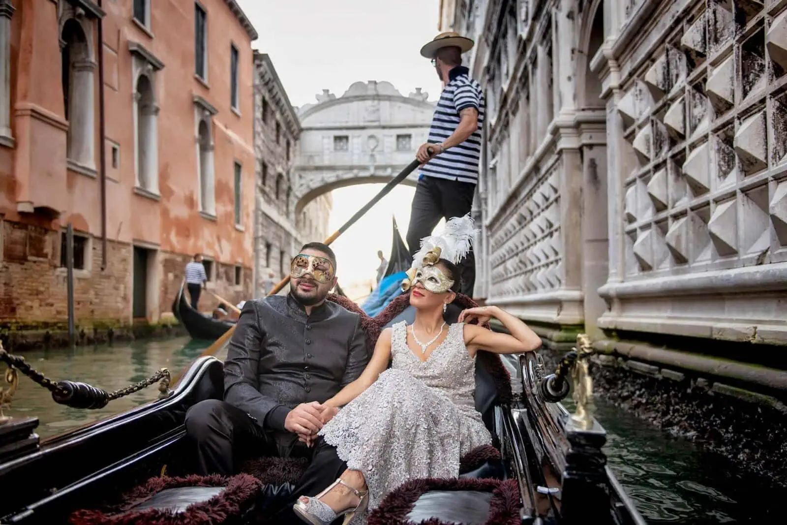 Engagement photos in Venice with a romantic gondola ride under the Bridge of Sighs.