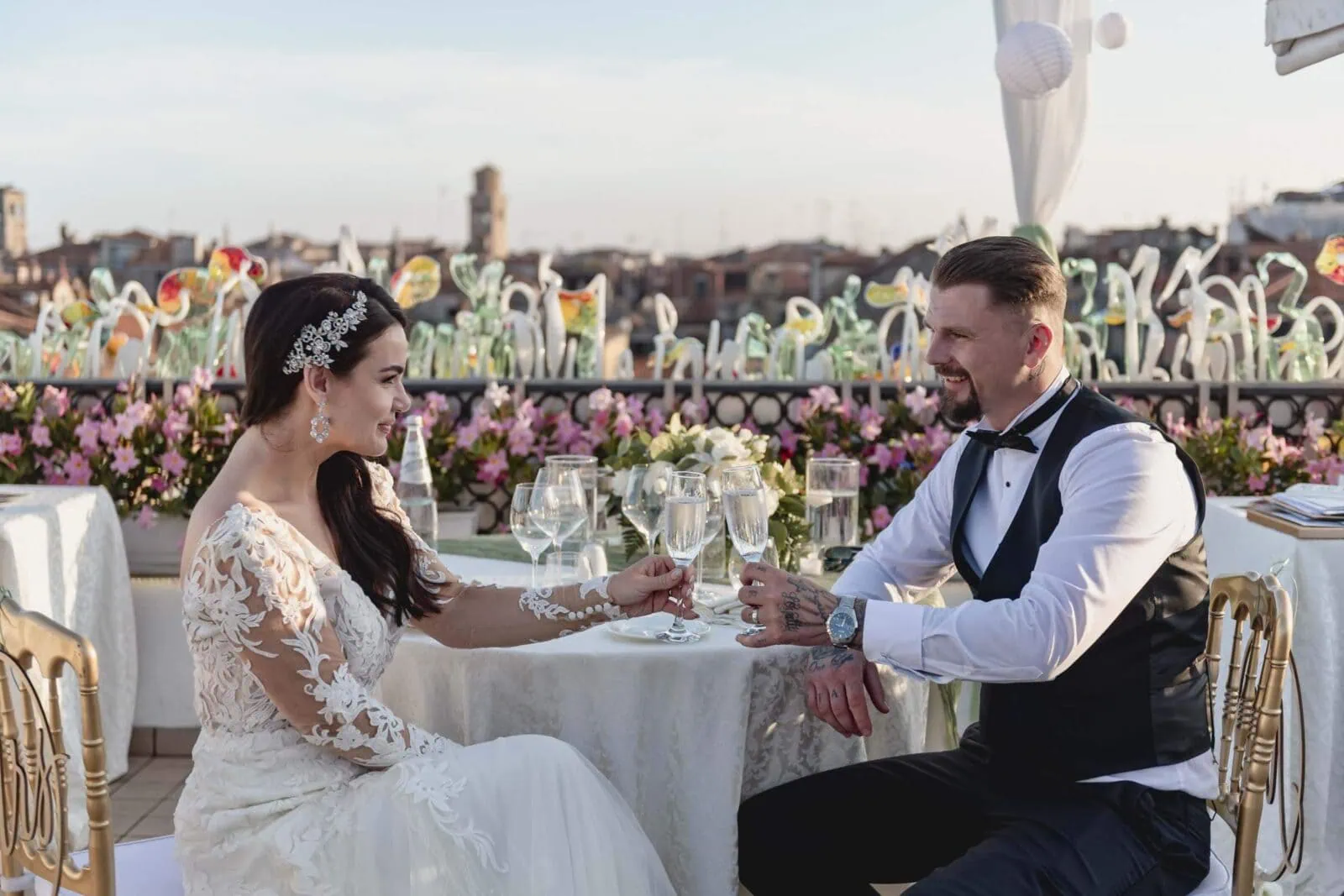 Romantic couple enjoying their honeymoon in Venice, Italy, captured in a scenic Venetian backdrop with historic canals, gondolas, and iconic landmarks.