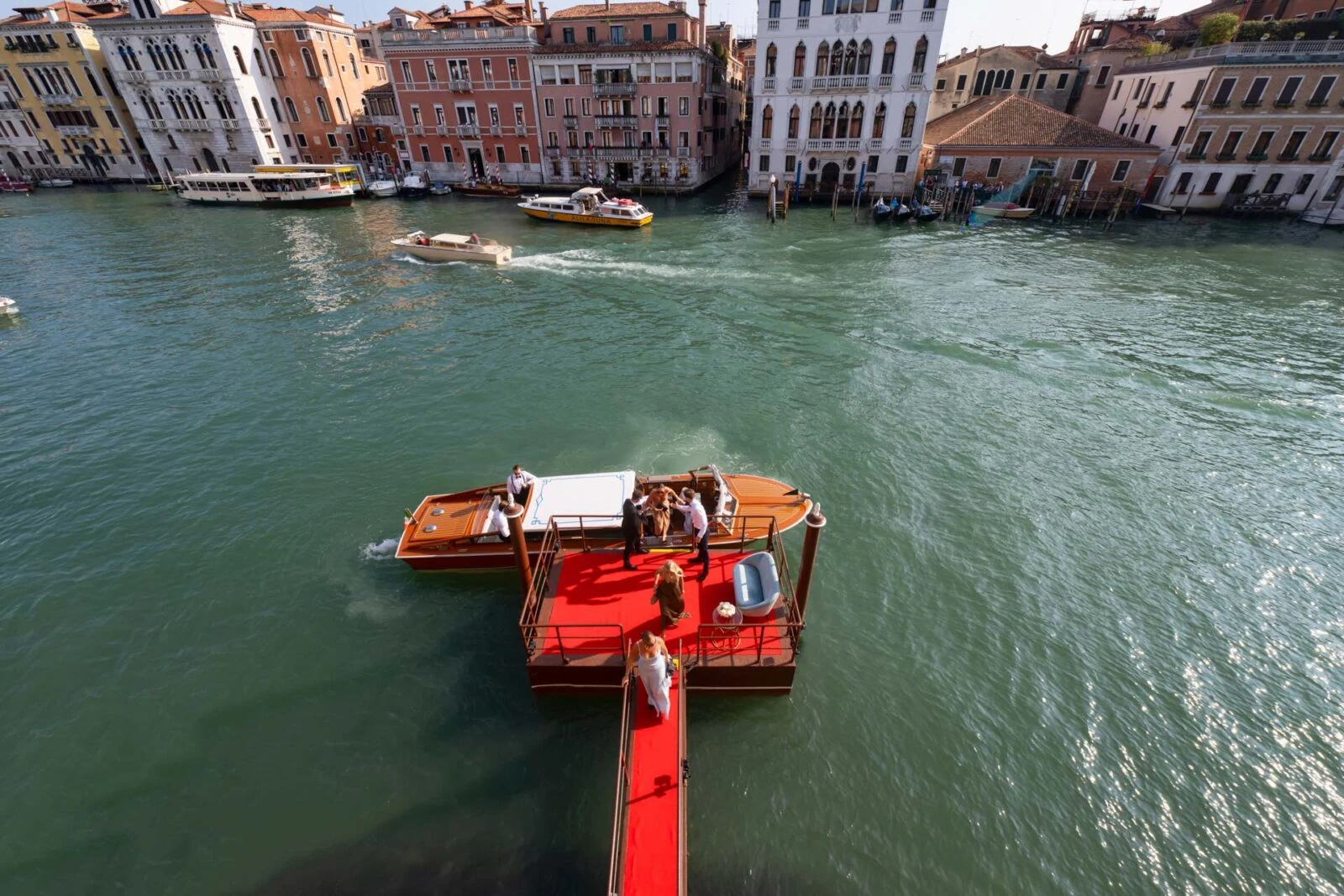 Bride and groom arriving in a private water taxi in Venice.