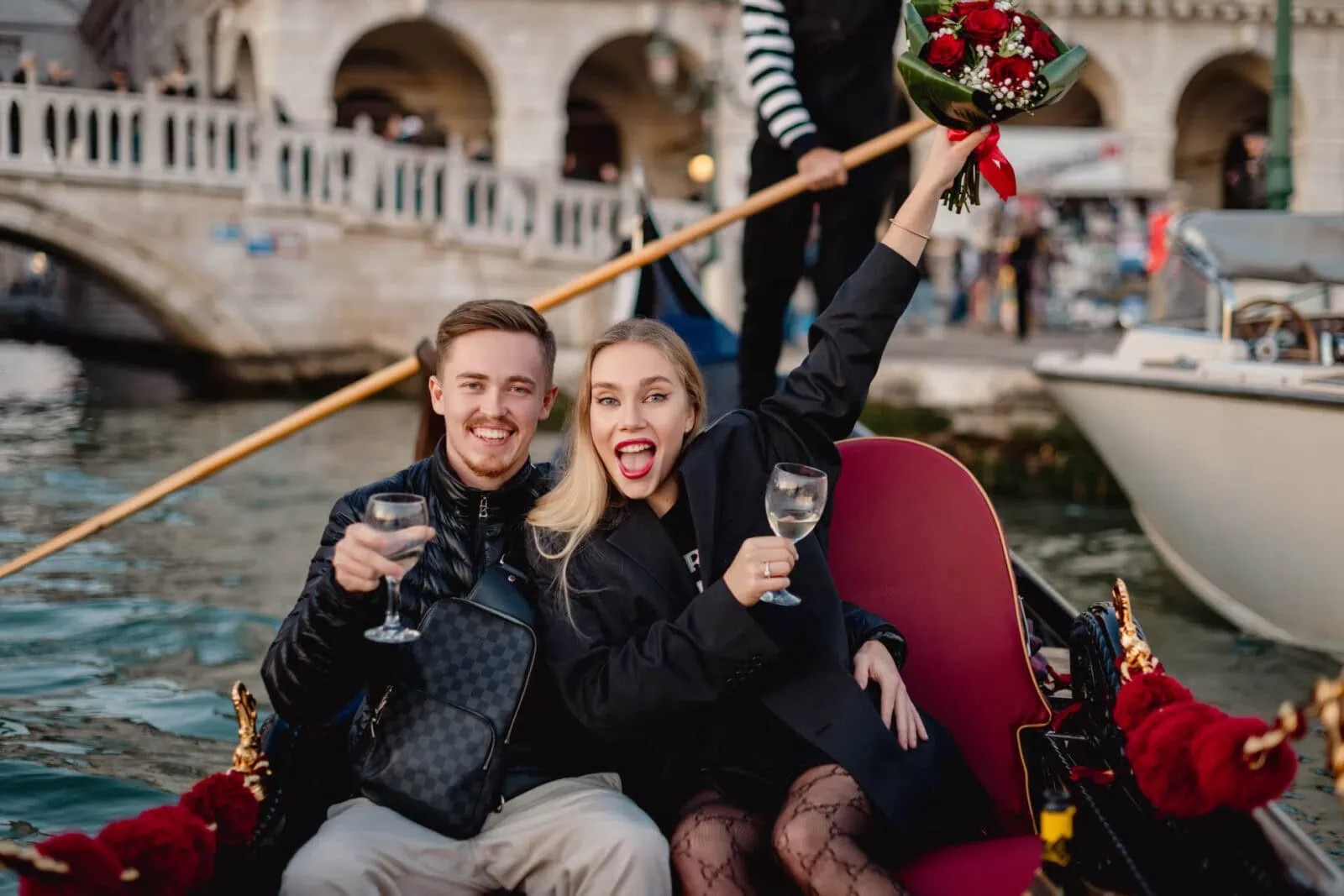 Surprise proposal on a gondola under the Bridge of Sighs – Venice engagement photography.