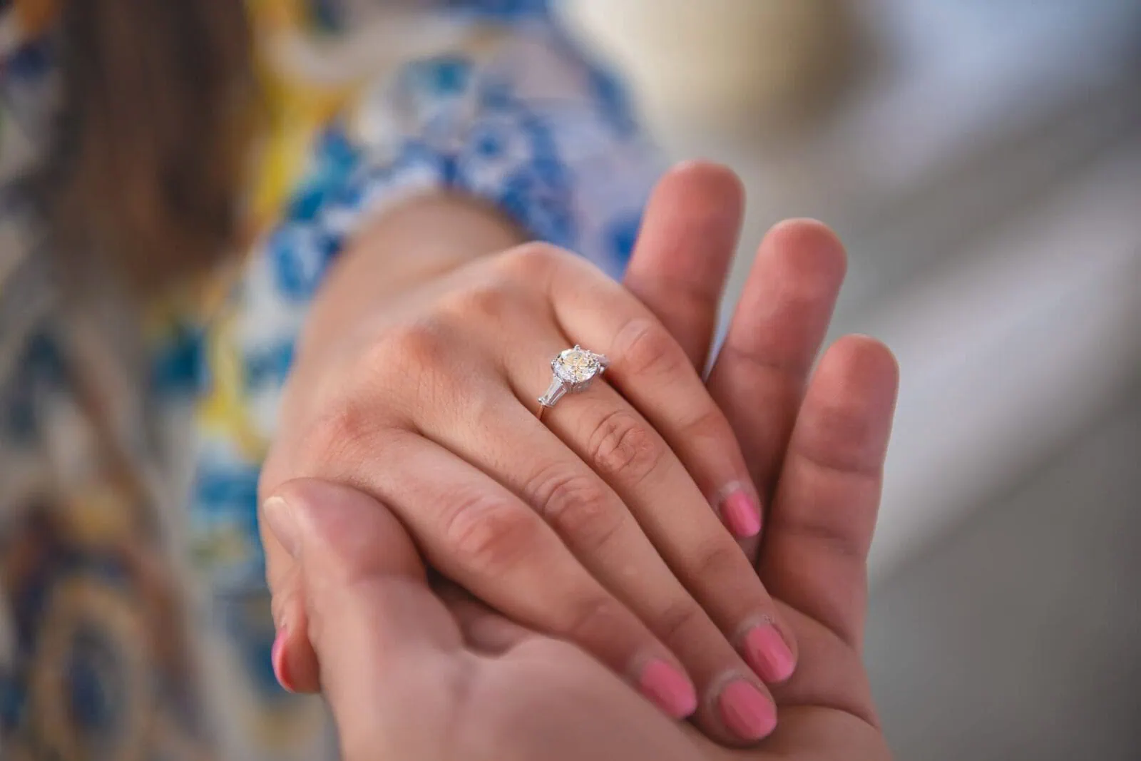 Close-up of a hand wearing an engagement ring during an engagement photoshoot in Venice.