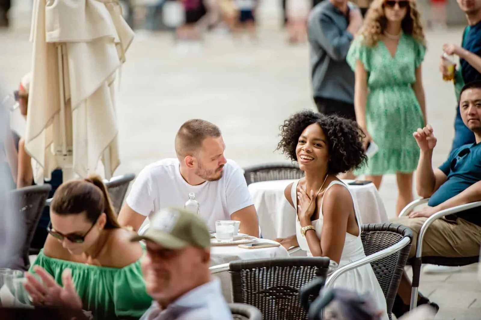 Elegant engagement photos in Venice featuring a couple toasting with champagne at Caffè Florian.