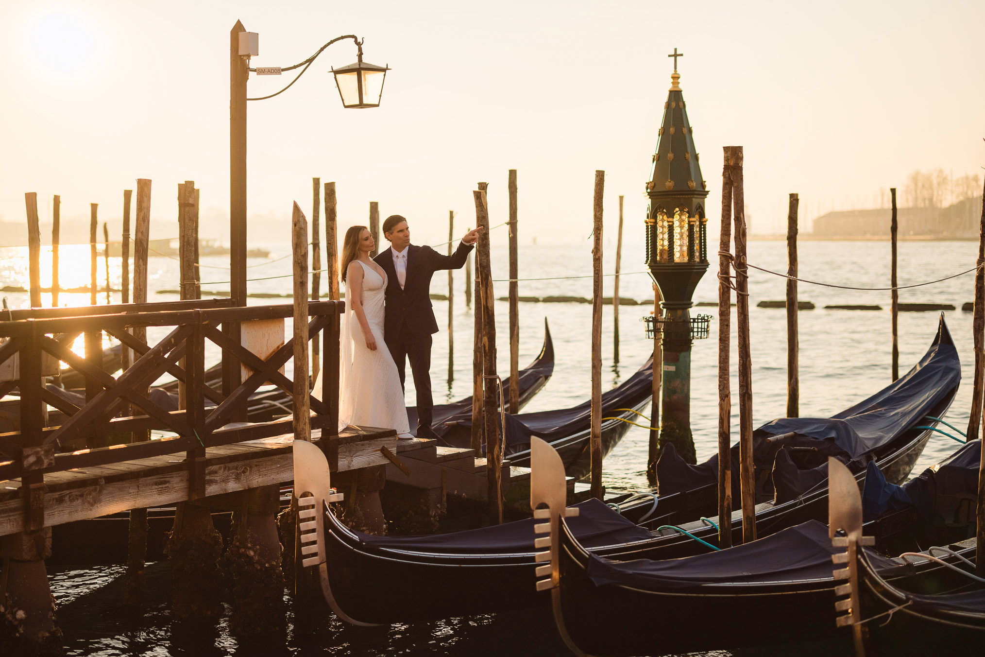 Venice honeymoon photographer – couple walking along Schiavoni waterfront