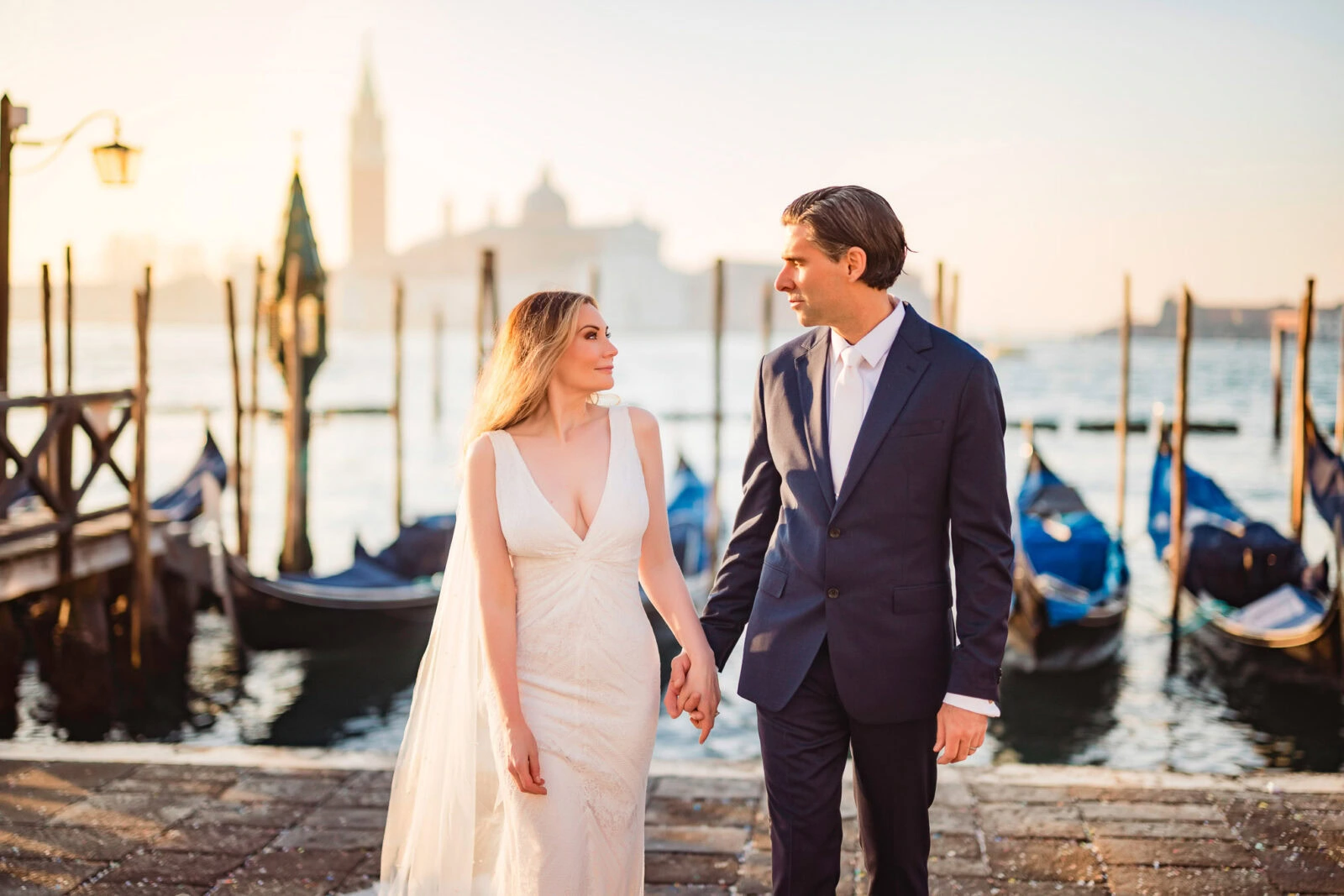 Venice honeymoon photographer – couple walking along Schiavoni waterfront
