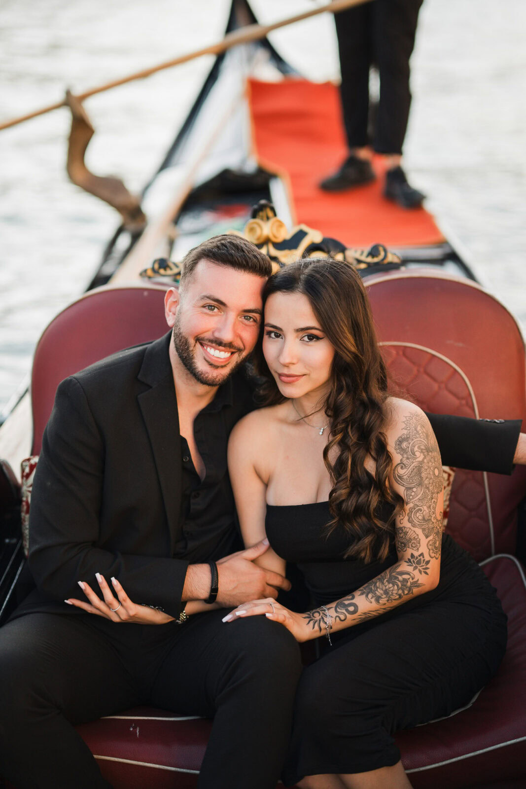 Couple enjoying a romantic gondola ride after their proposal