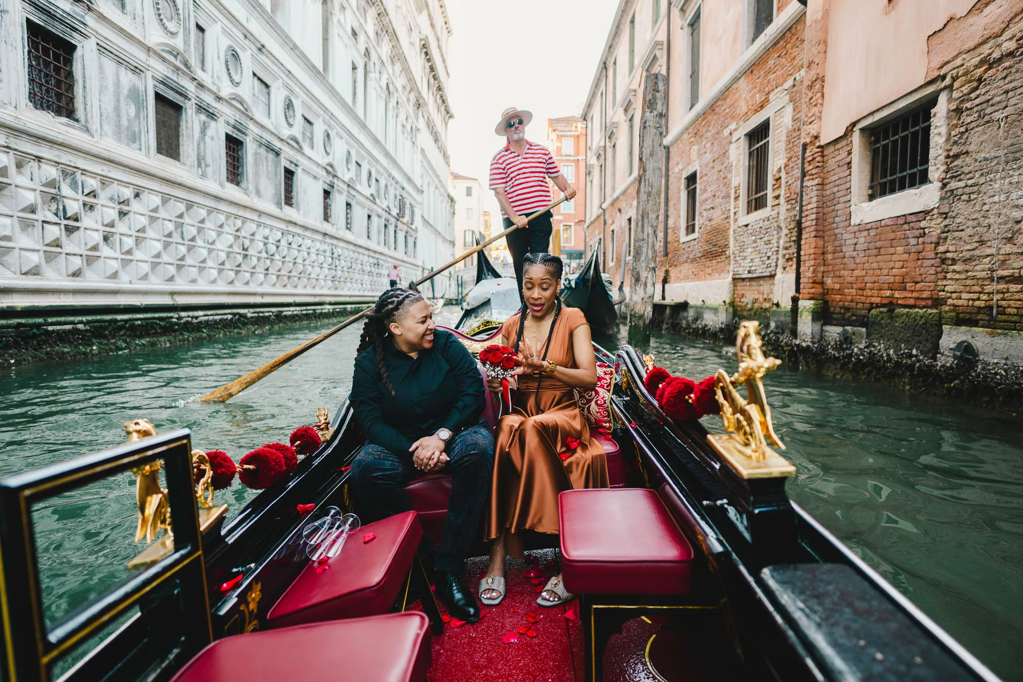 Lesbian proposal in Venice under the Bridge of Sighs in a gondola at sunset