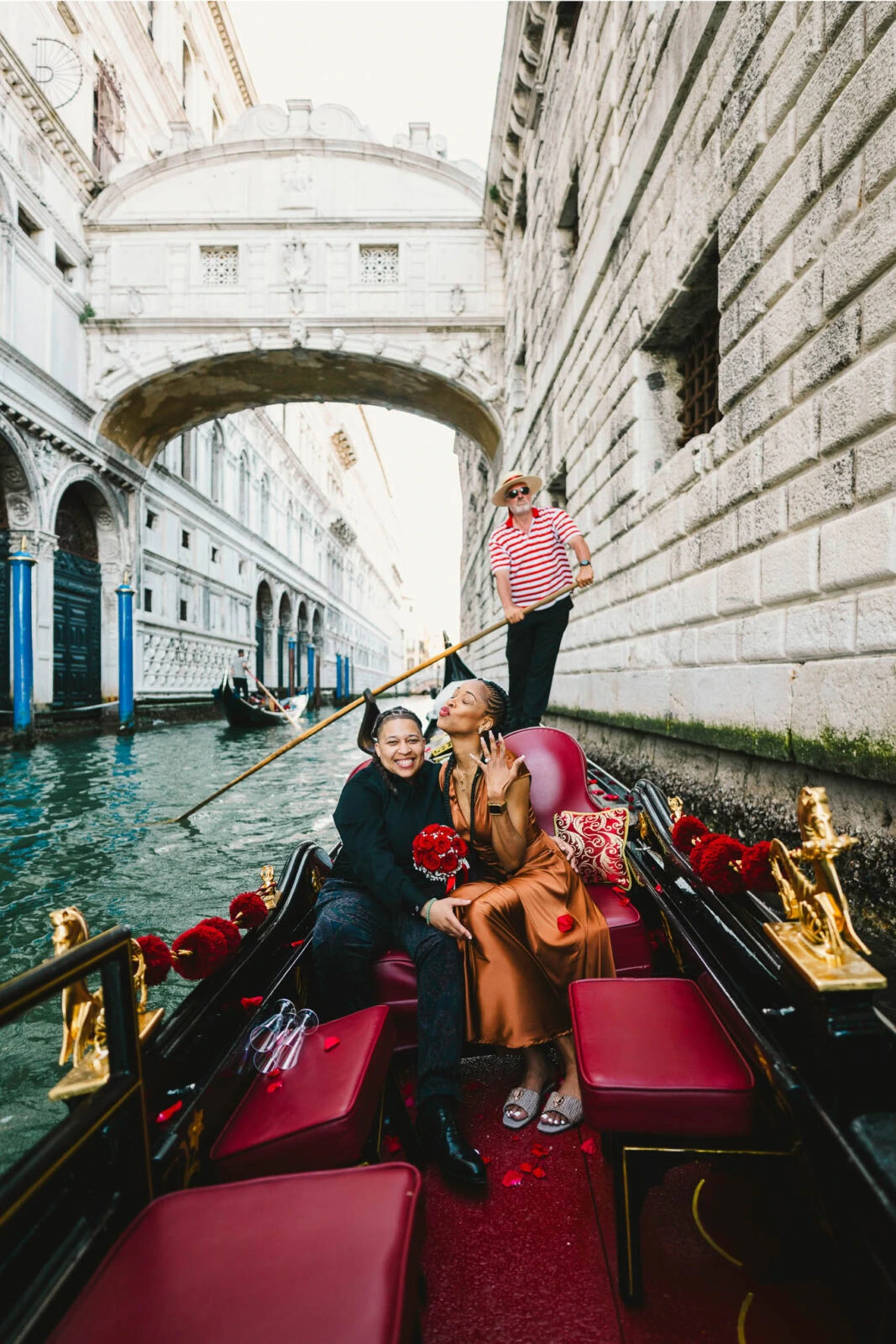 Lesbian proposal in Venice under the Bridge of Sighs in a gondola at sunset