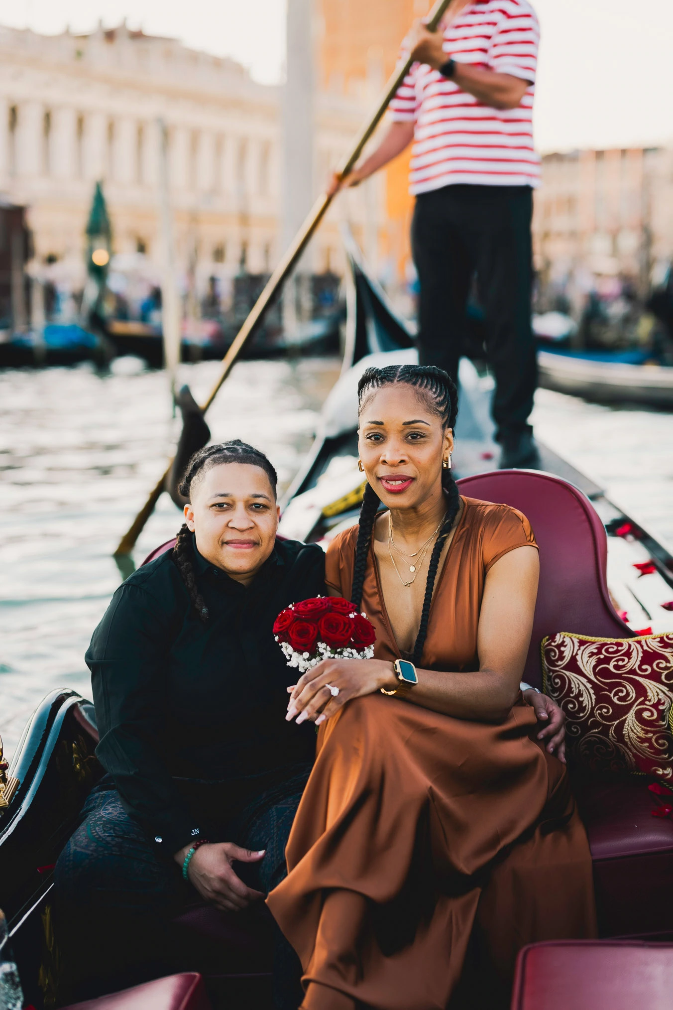 Lesbian proposal in Venice under the Bridge of Sighs in a gondola at sunset