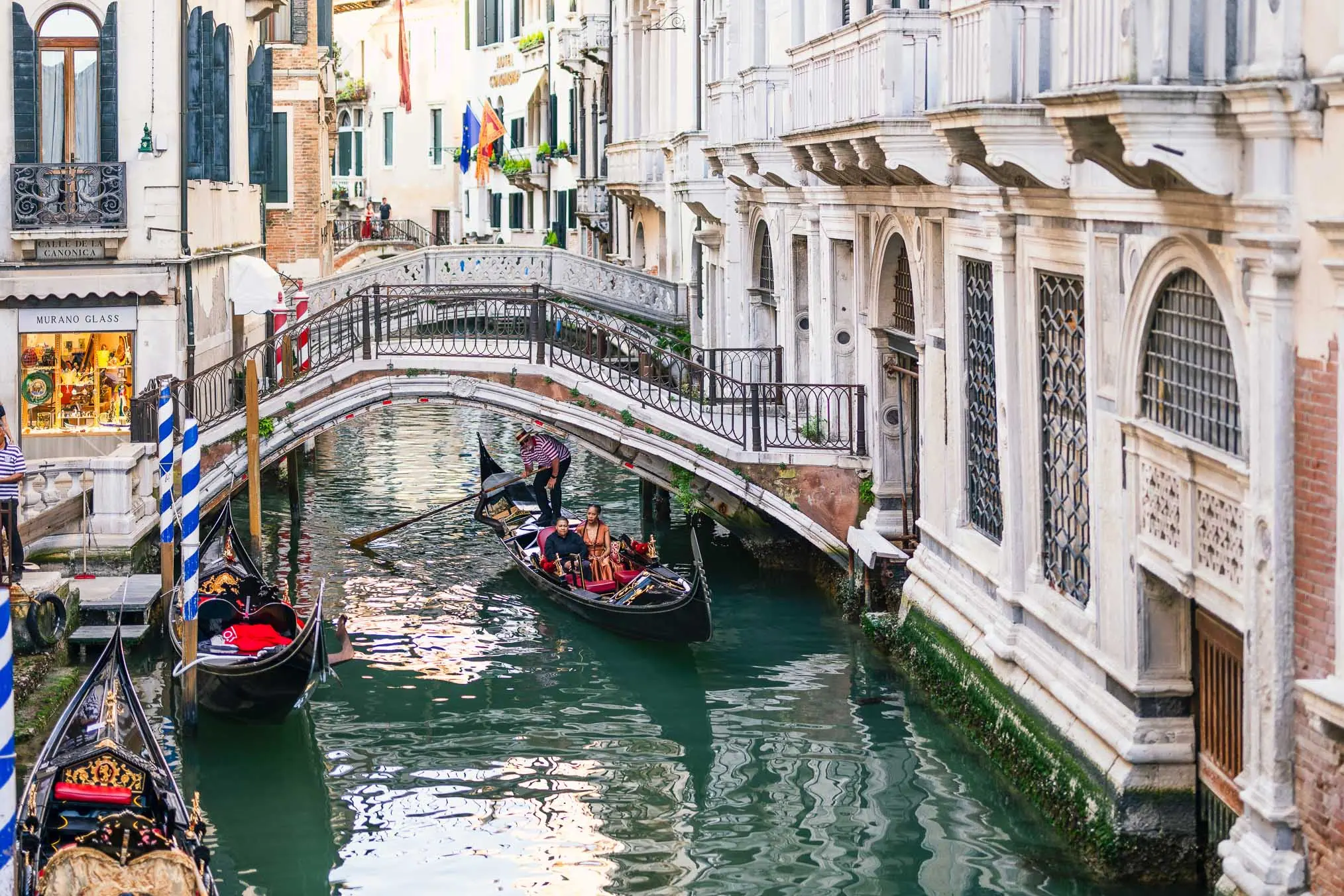 Lesbian proposal in Venice under the Bridge of Sighs in a gondola at sunset