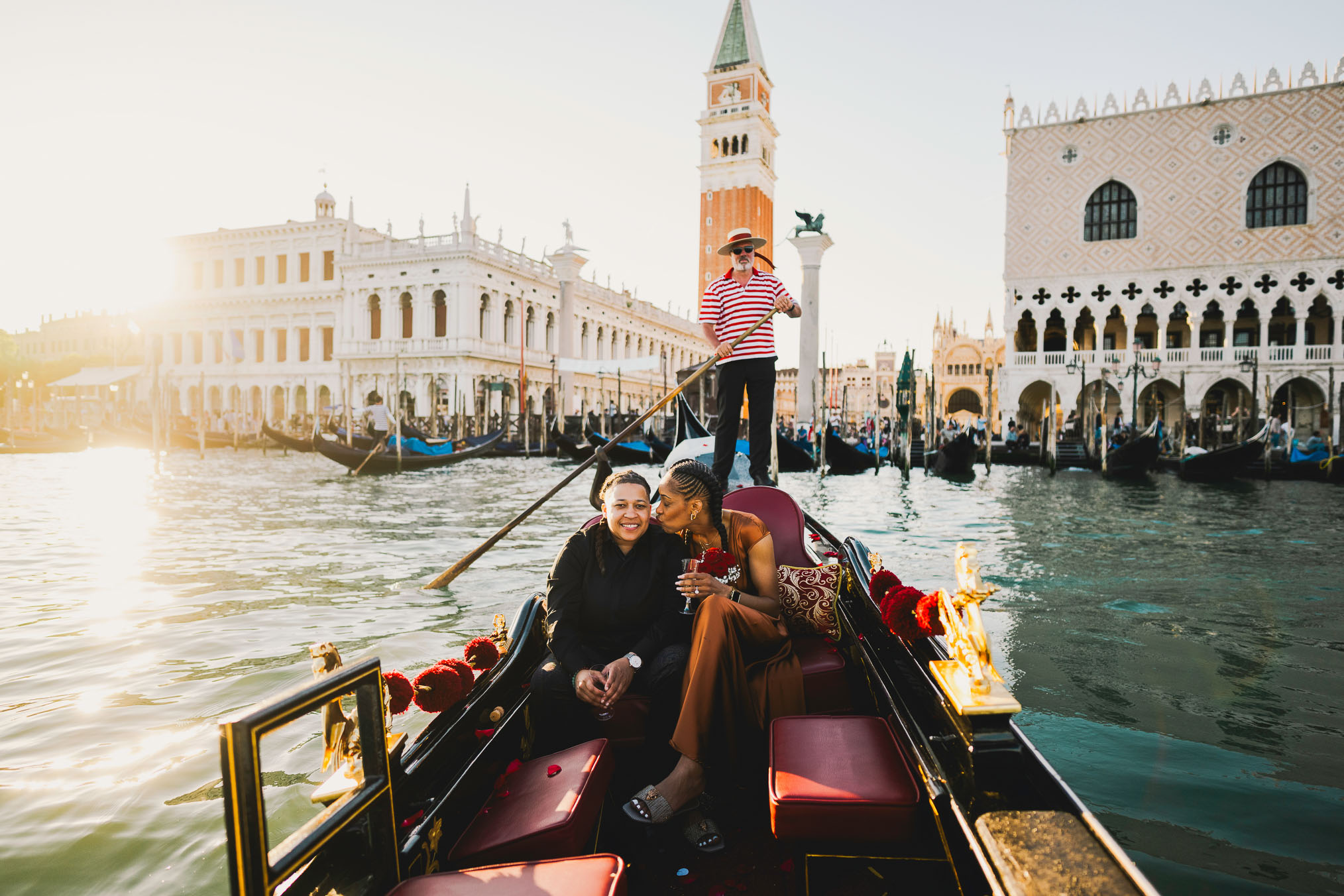 Lesbian proposal in Venice under the Bridge of Sighs in a gondola at sunset