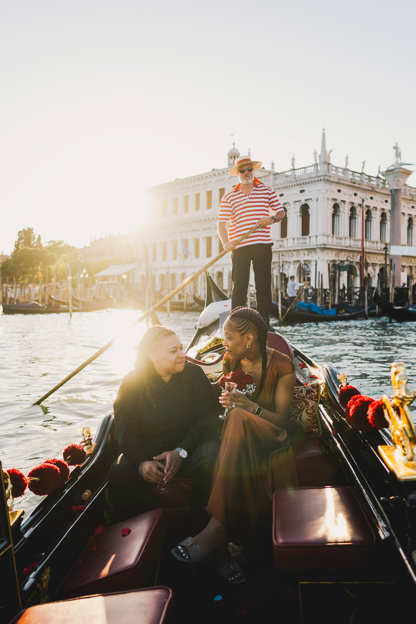 Lesbian proposal in Venice under the Bridge of Sighs in a gondola at sunset