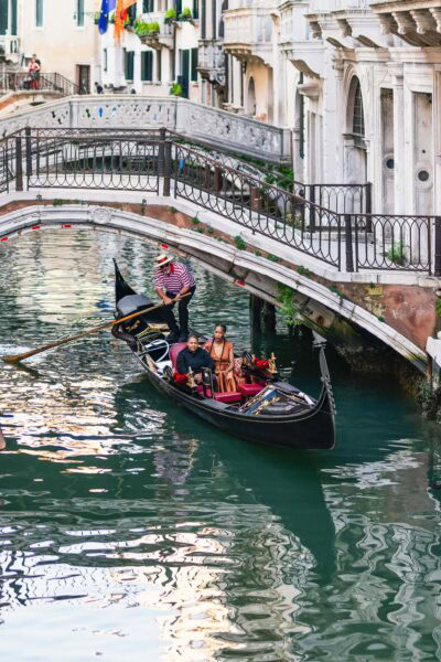 Lesbian proposal in Venice under the Bridge of Sighs in a gondola at sunset