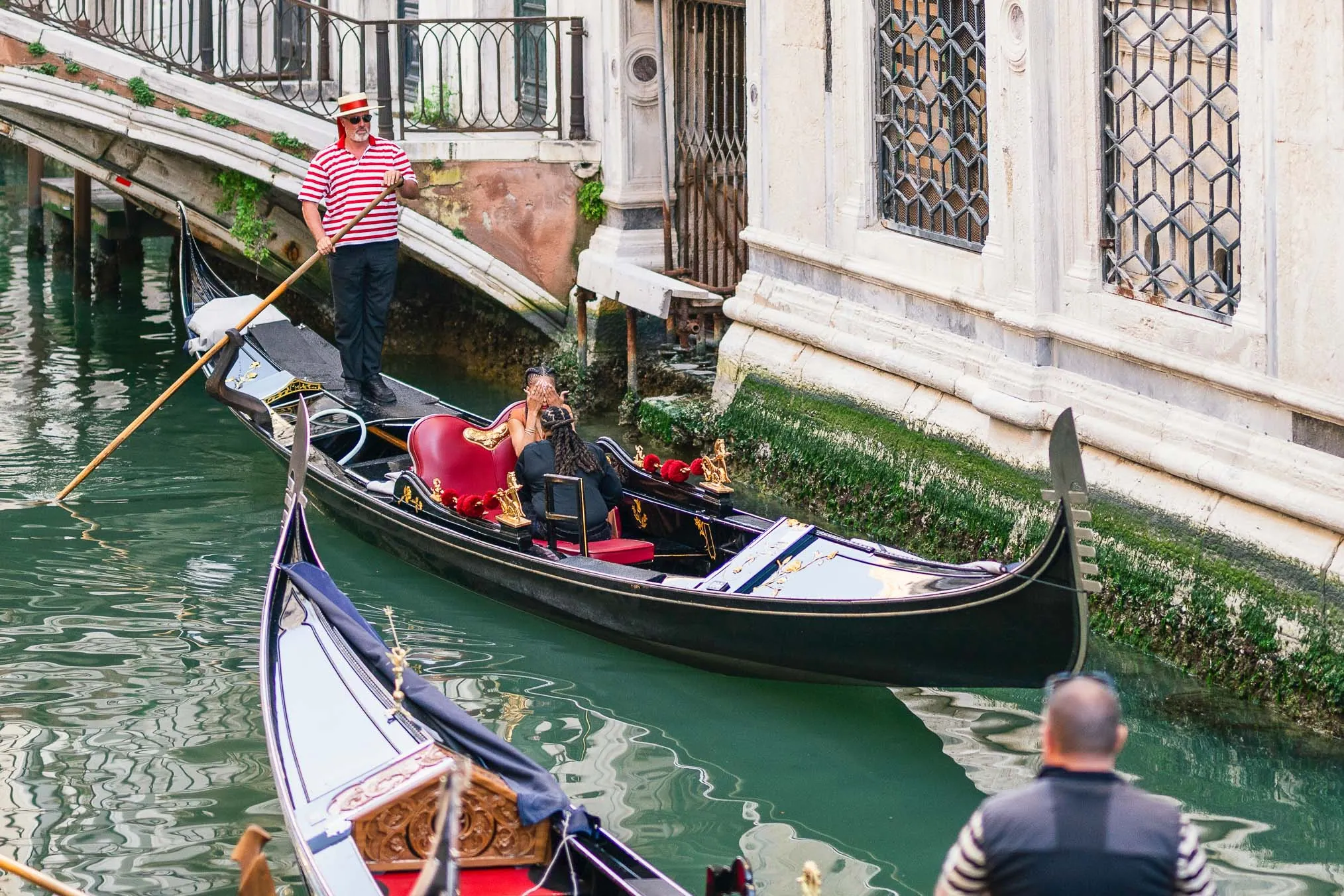 Lesbian proposal in Venice under the Bridge of Sighs in a gondola at sunset