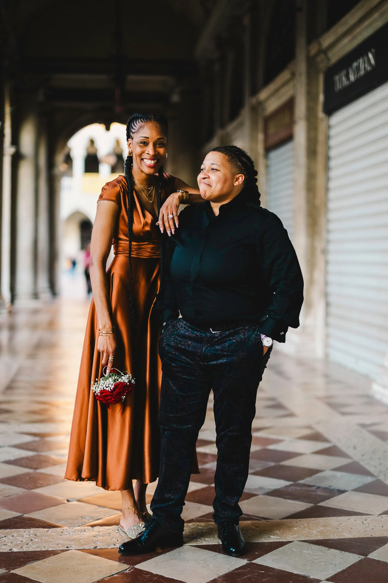 Two women in love under the arcades of San Marco