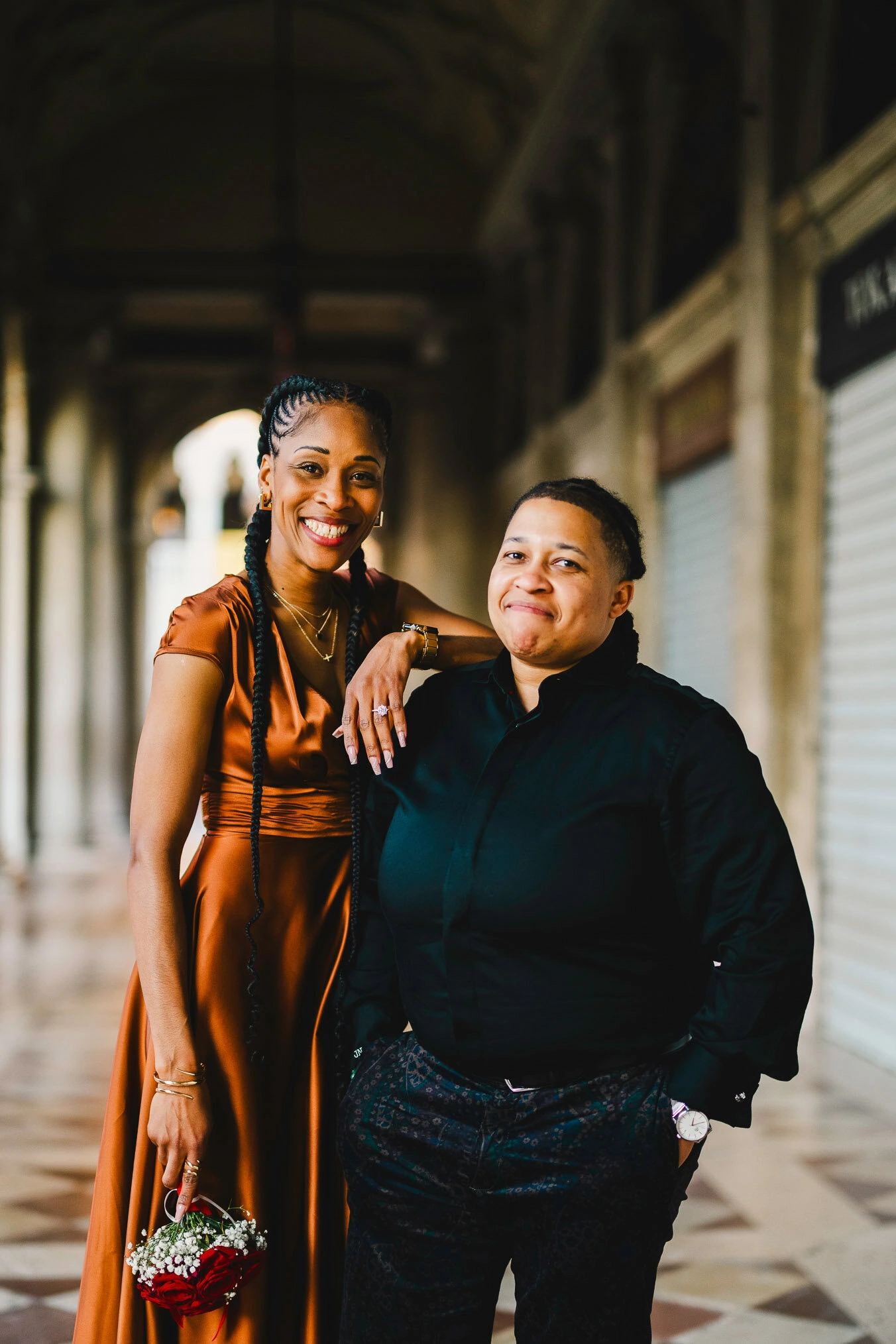Two women in love under the arcades of San Marco