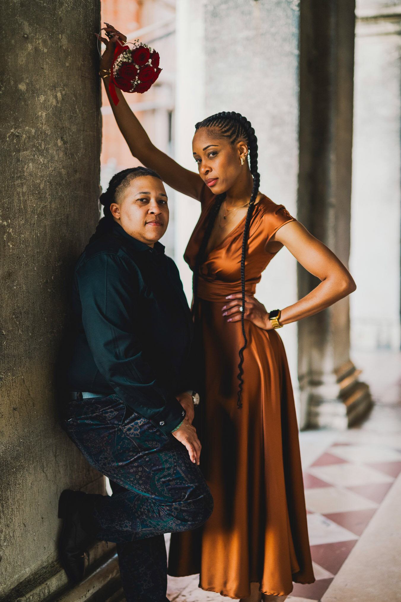 Two women in love under the arcades of San Marco