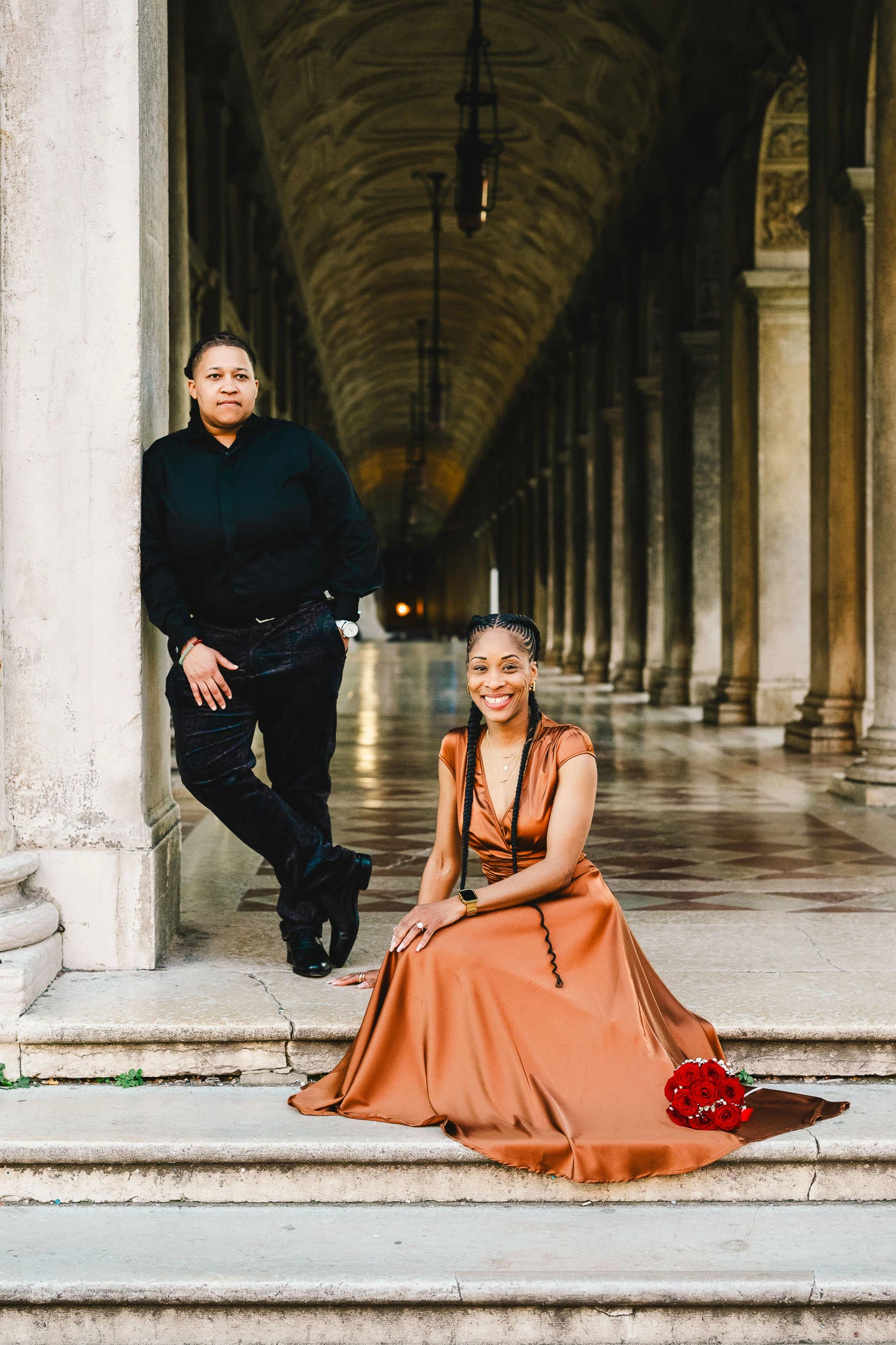 Two women in love under the arcades of San Marco