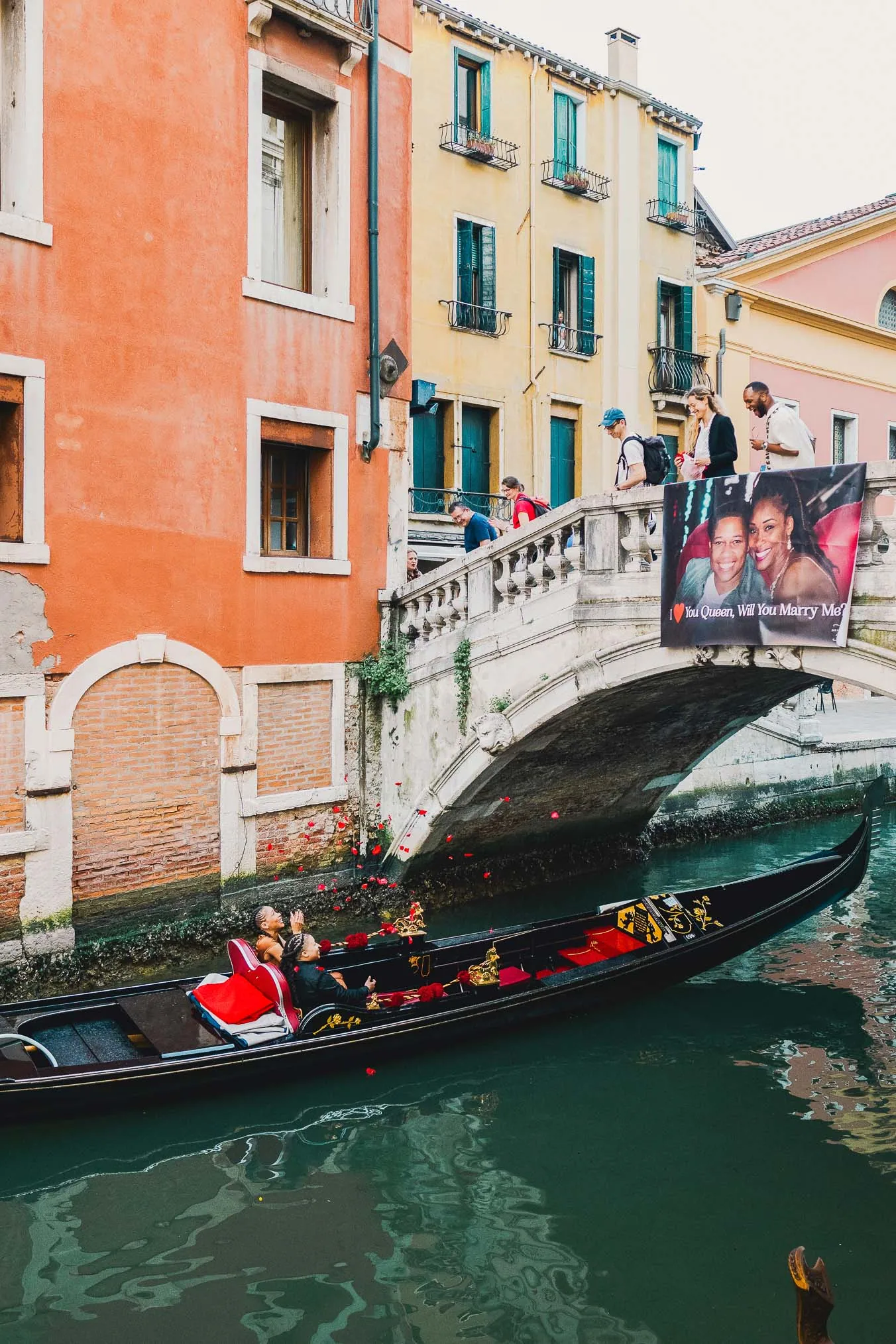 Lesbian proposal in Venice under the Bridge of Sighs in a gondola at sunset