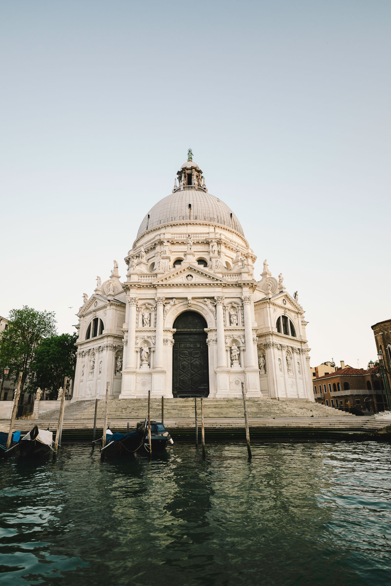 Lesbian couple in front of Santa Maria della Salute during their proposal in Venice