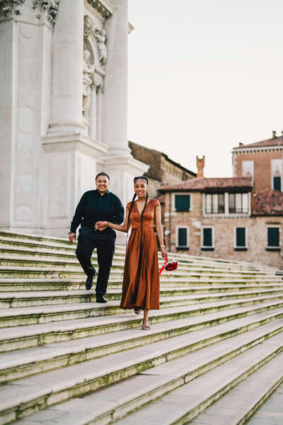 Lesbian couple in front of Santa Maria della Salute during their proposal in Venice
