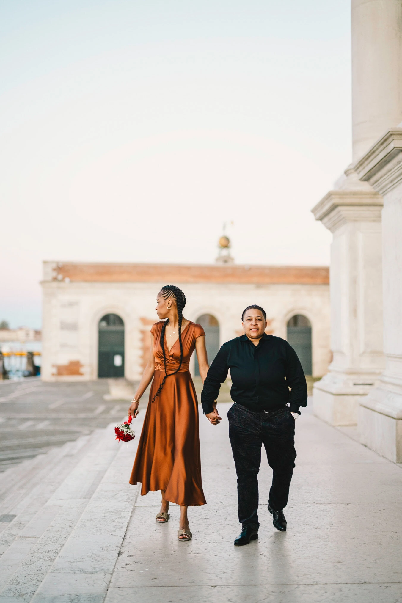 Lesbian couple in front of Santa Maria della Salute during their proposal in Venice