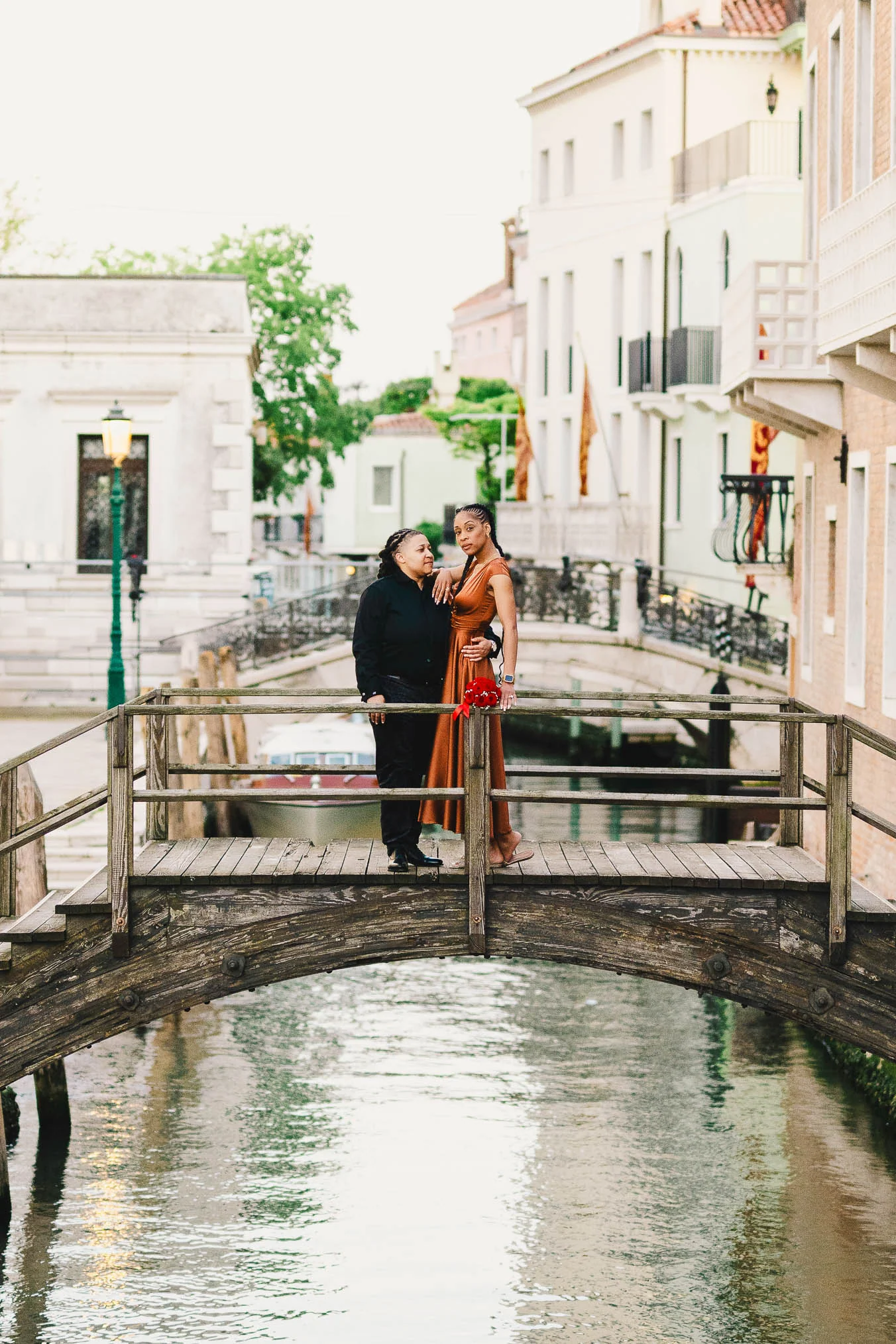 Lesbian couple in front of Santa Maria della Salute during their proposal in Venice