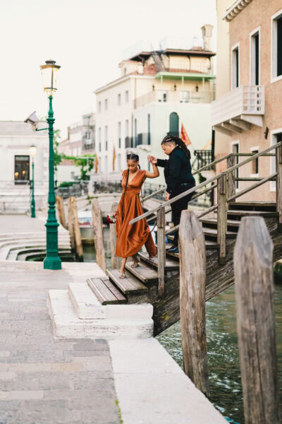 Lesbian couple in front of Santa Maria della Salute during their proposal in Venice