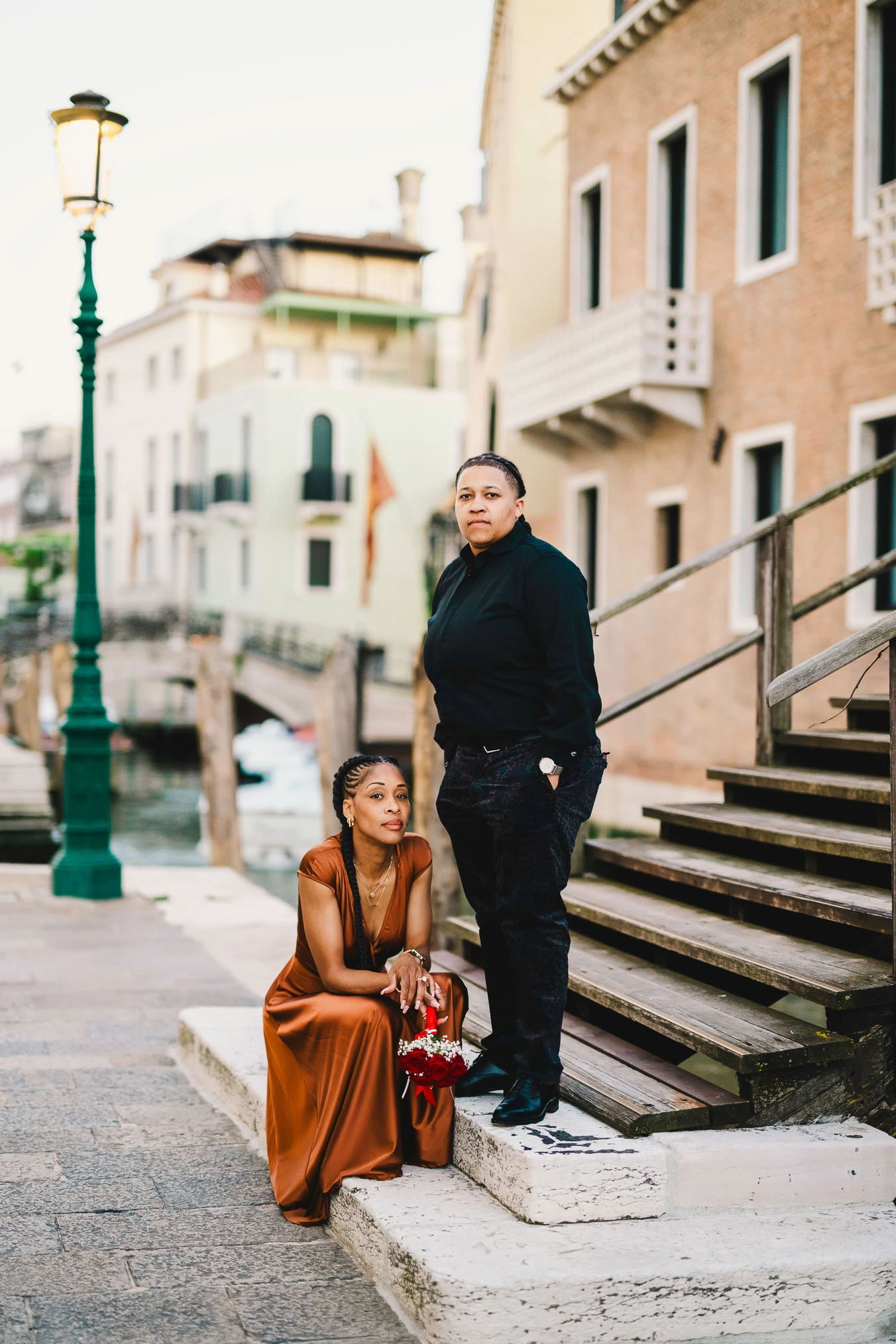 Lesbian couple in front of Santa Maria della Salute during their proposal in Venice