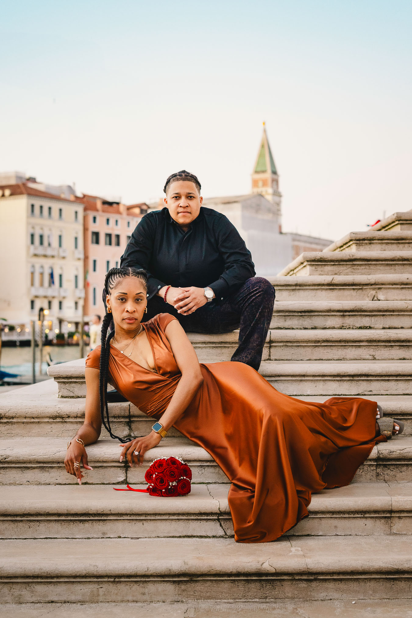 Lesbian couple in front of Santa Maria della Salute during their proposal in Venice