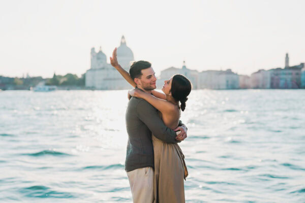 Man proposing to his girlfriend at sunset on San Giorgio Maggiore island
