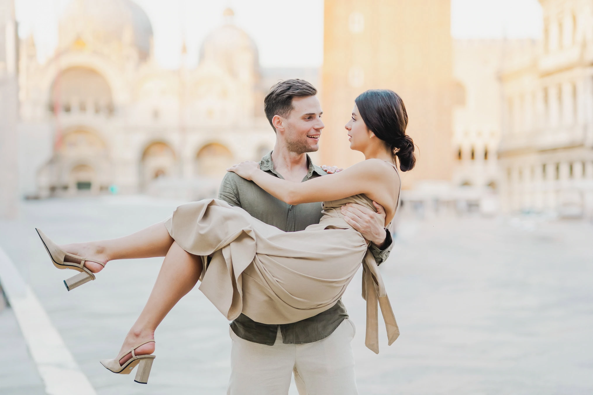 Couple basking in the golden hour light in Venice
