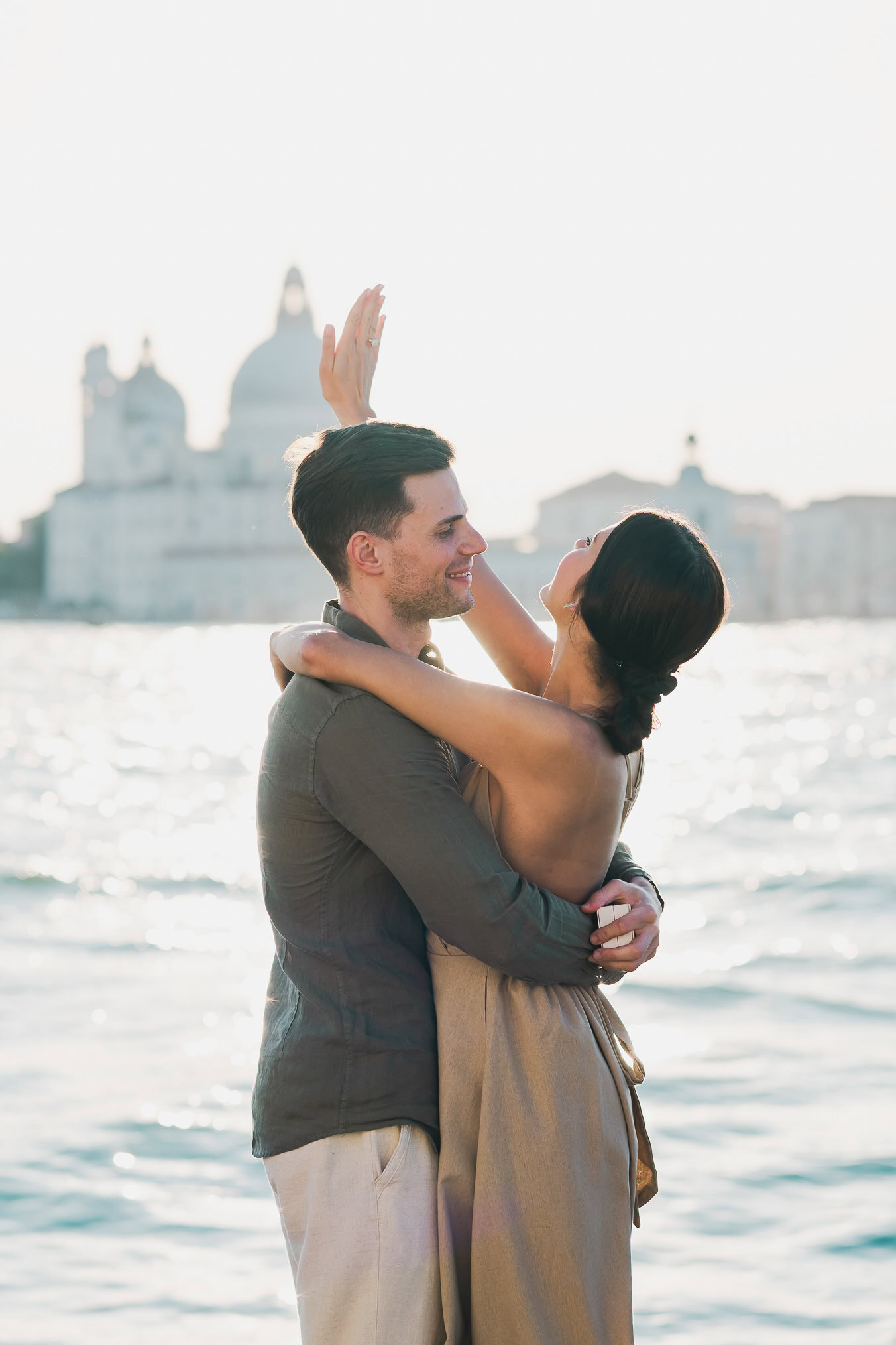 Man proposing to his girlfriend at sunset on San Giorgio Maggiore island