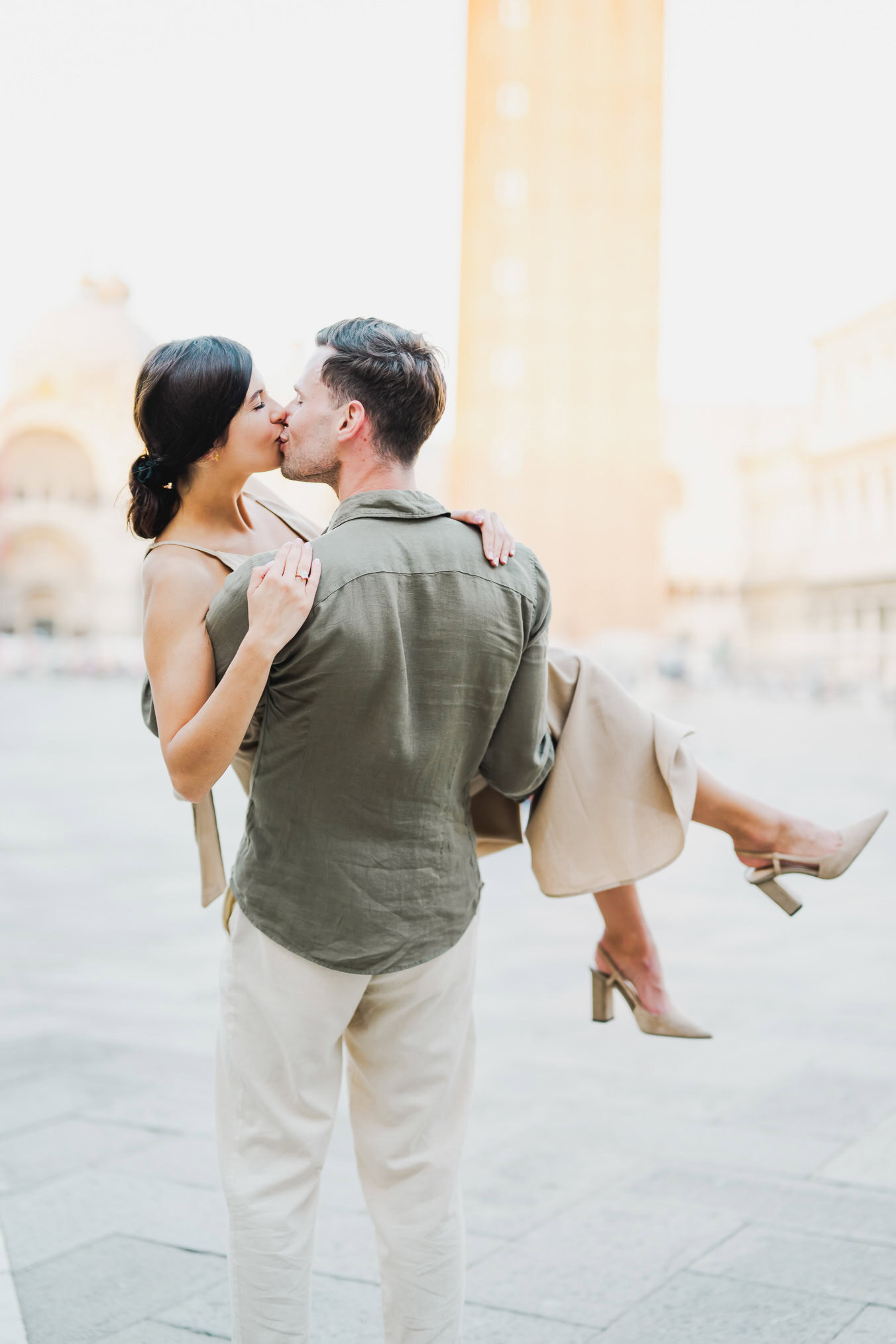 Couple basking in the golden hour light in Venice