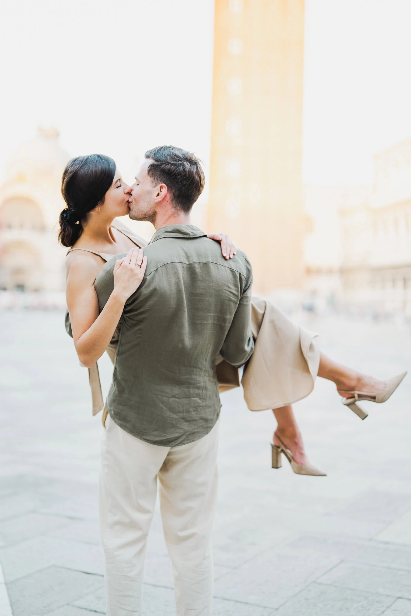 Couple basking in the golden hour light in Venice