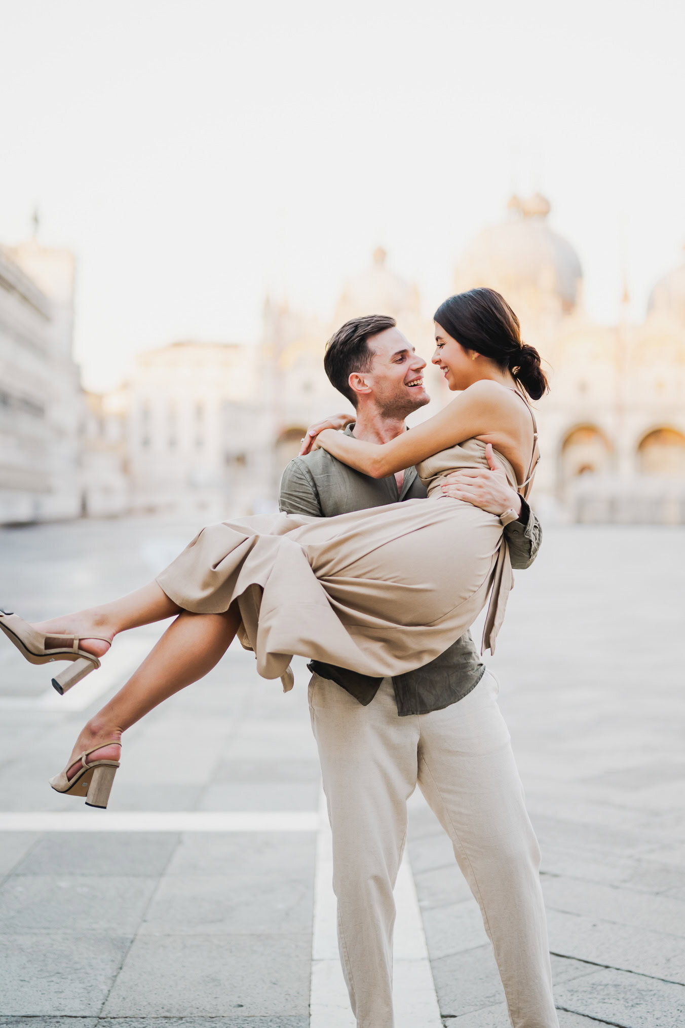 Couple basking in the golden hour light in Venice