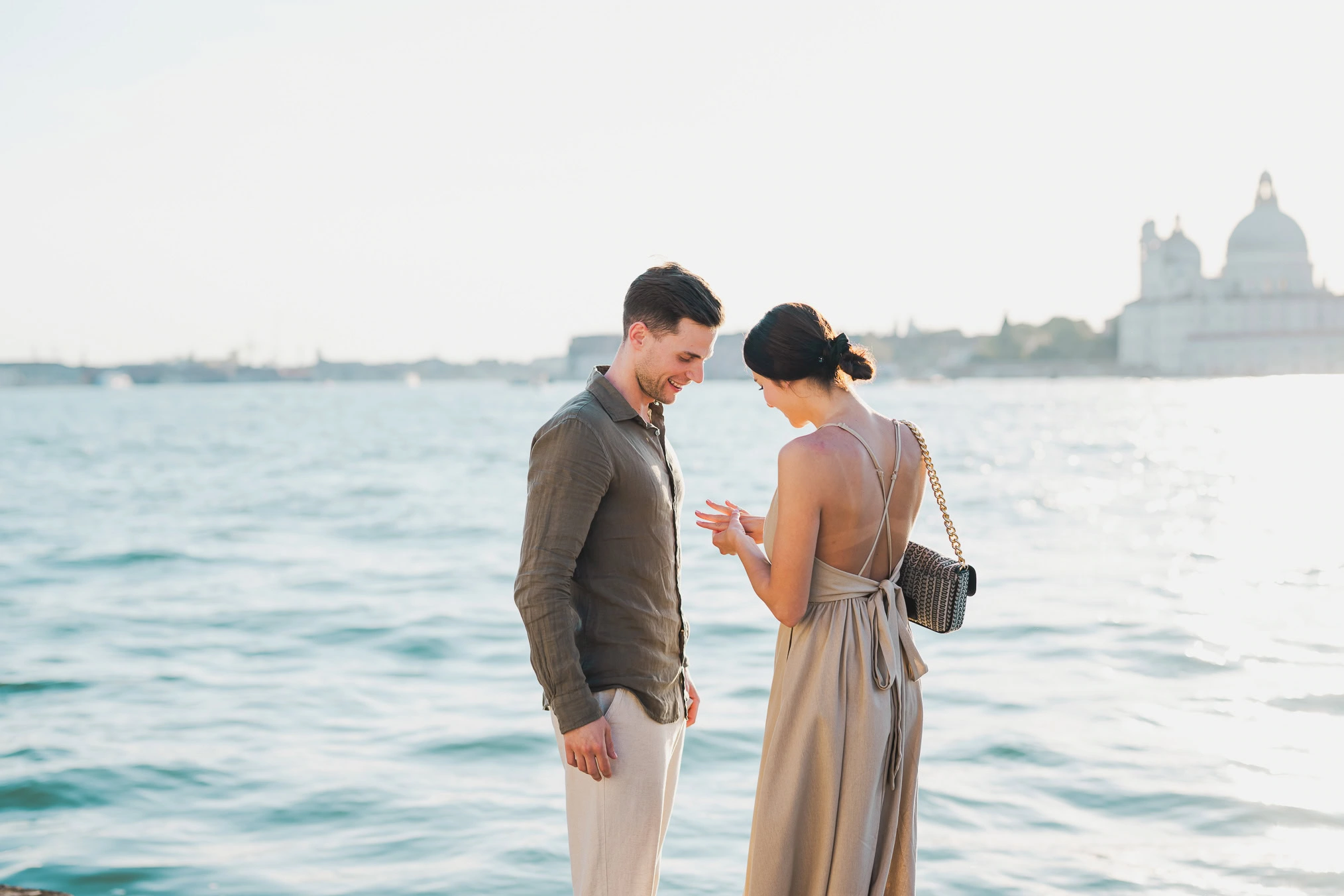 Man proposing to his girlfriend at sunset on San Giorgio Maggiore island