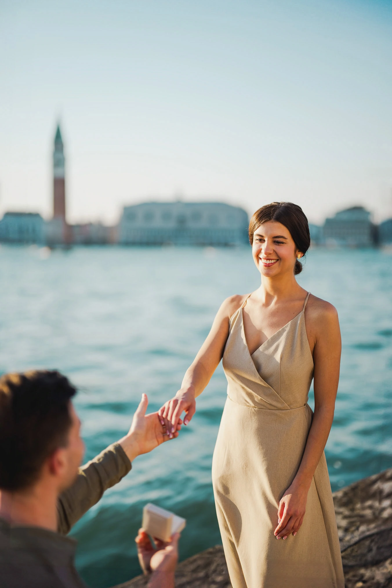 Man proposing to his girlfriend at sunset on San Giorgio Maggiore island