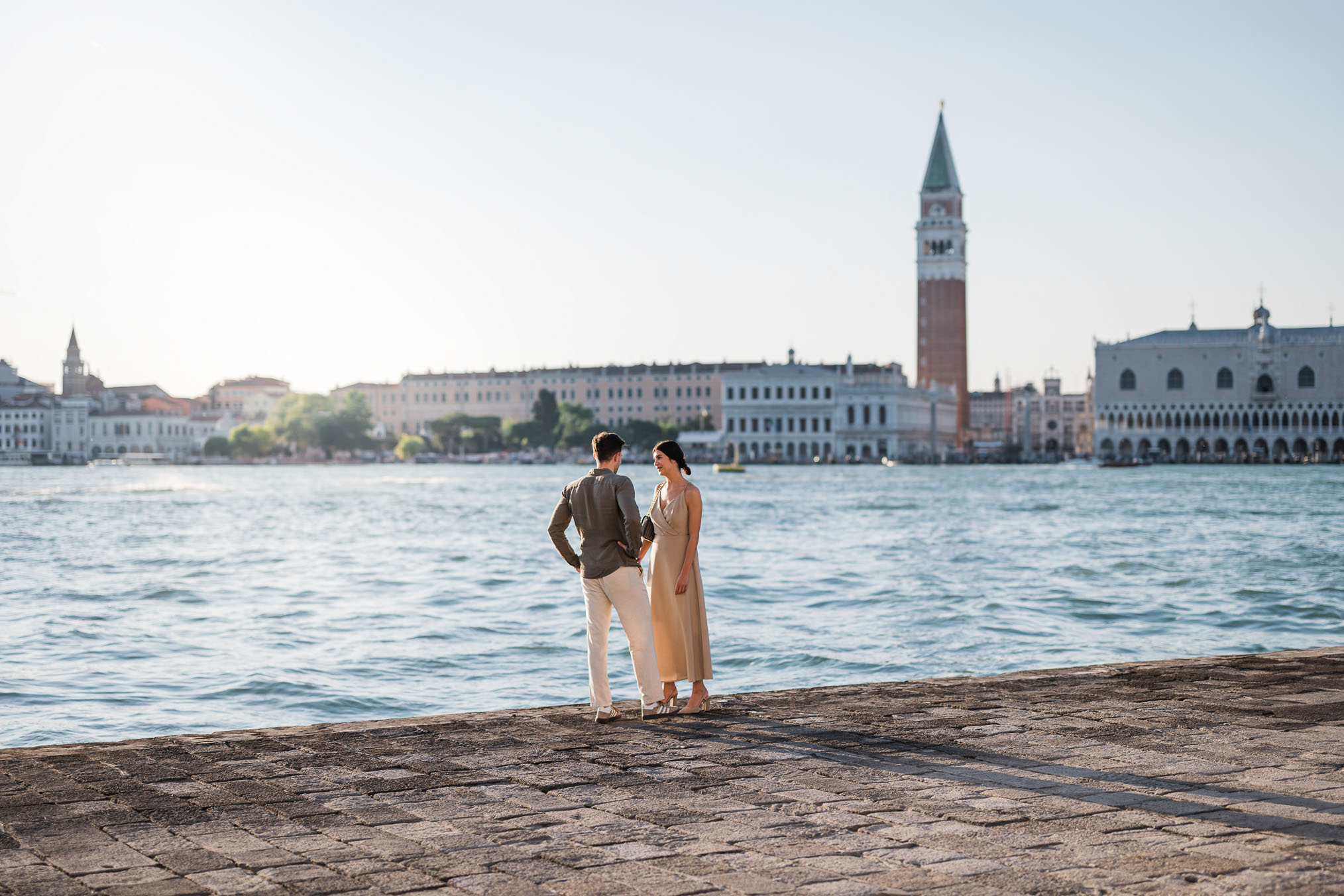 Man proposing to his girlfriend at sunset on San Giorgio Maggiore island