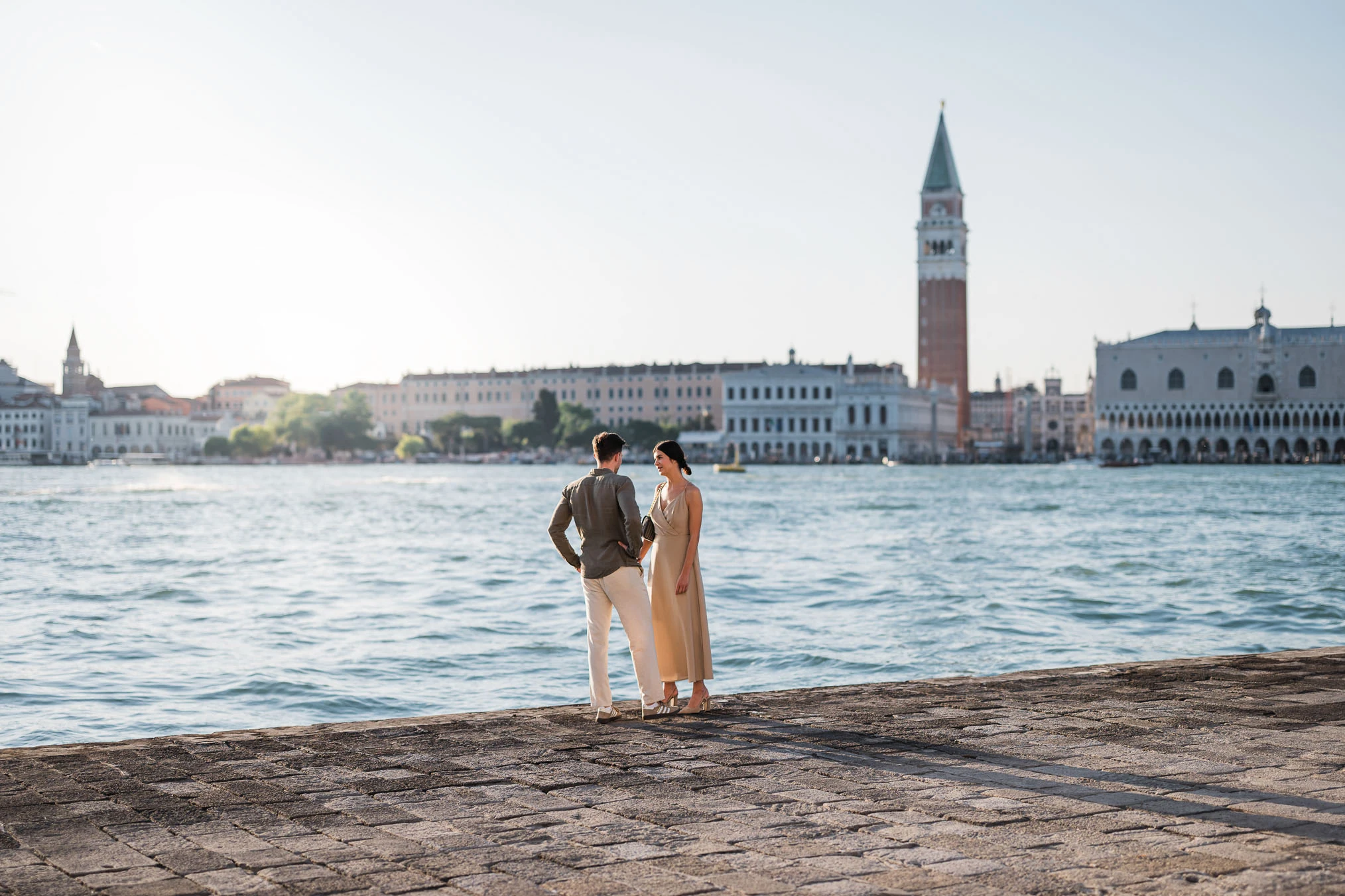 Man proposing to his girlfriend at sunset on San Giorgio Maggiore island