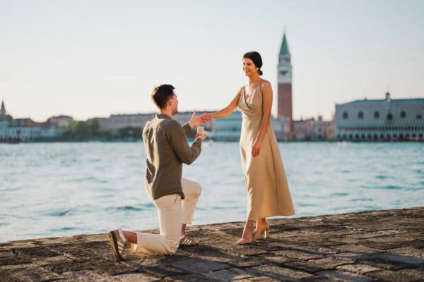 Man proposing to his girlfriend at sunset on San Giorgio Maggiore island