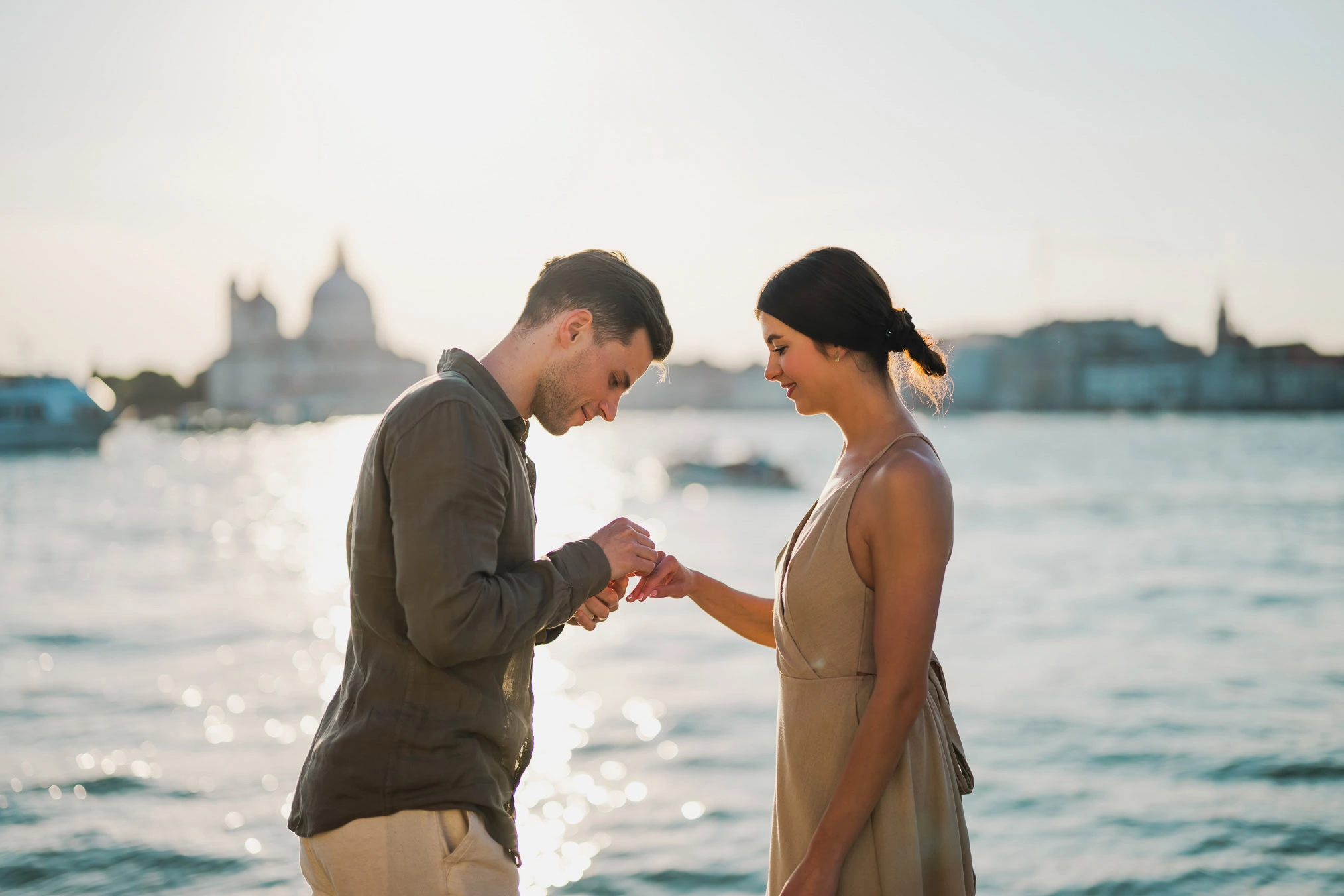 Man proposing to his girlfriend at sunset on San Giorgio Maggiore island