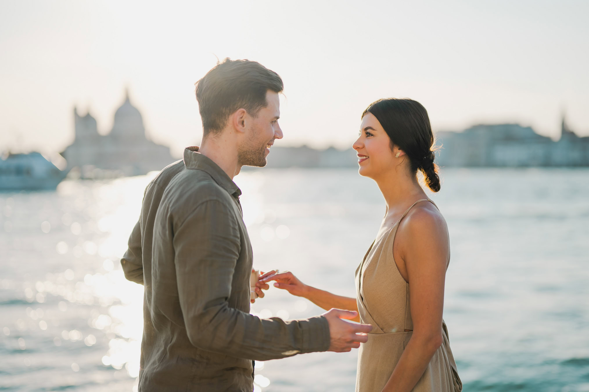 Man proposing to his girlfriend at sunset on San Giorgio Maggiore island