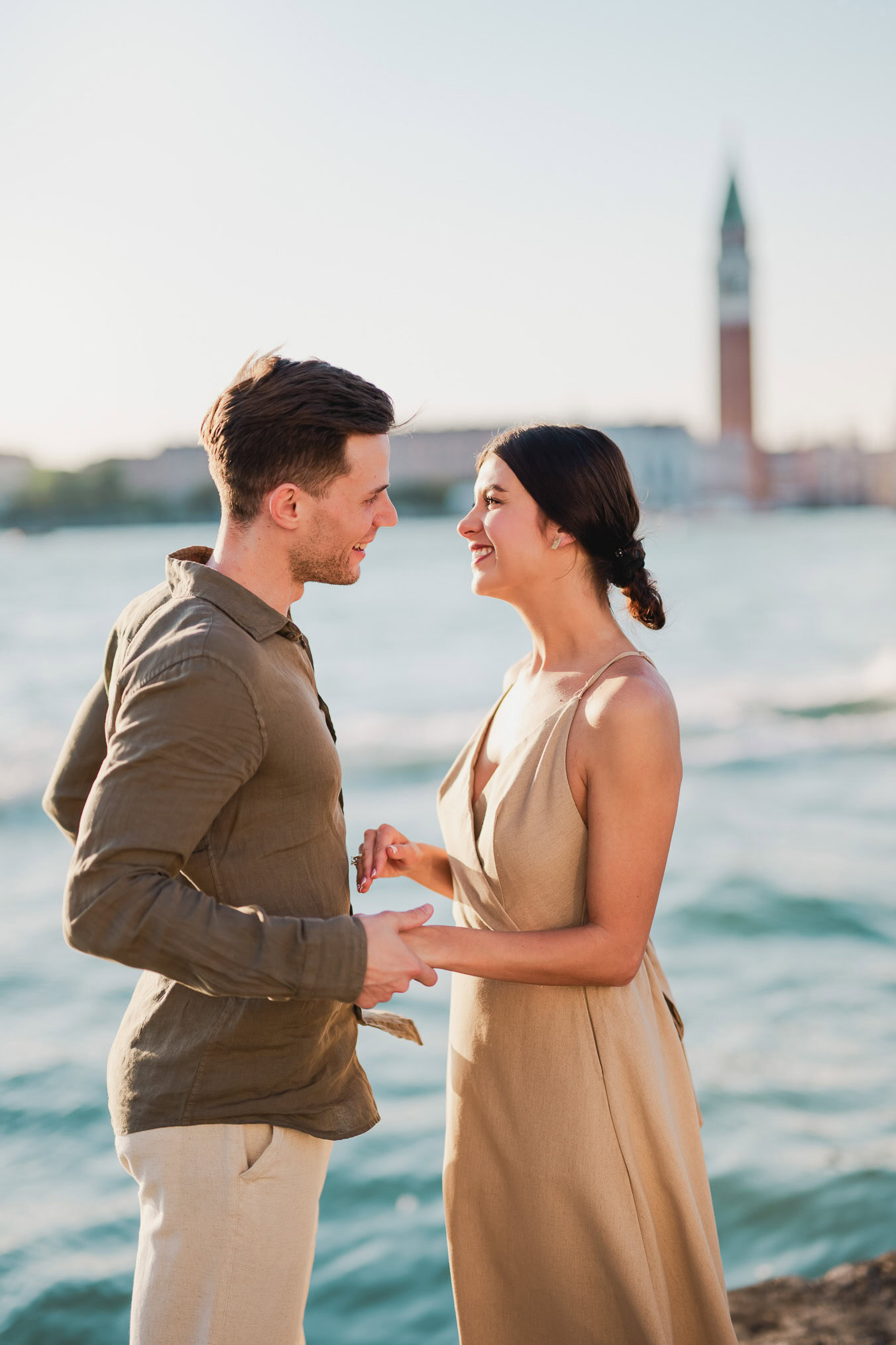 Man proposing to his girlfriend at sunset on San Giorgio Maggiore island