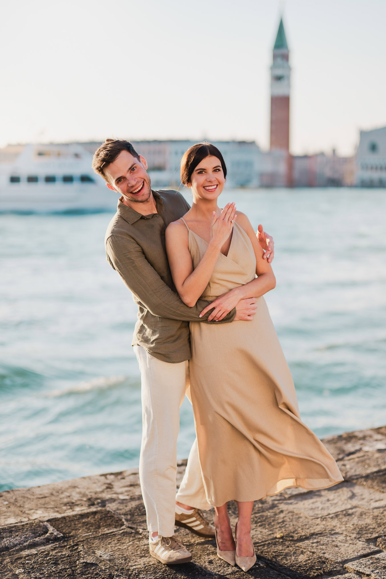 Man proposing to his girlfriend at sunset on San Giorgio Maggiore island