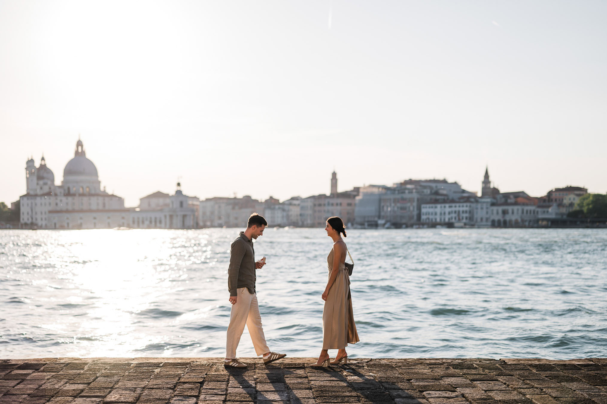 Man proposing to his girlfriend at sunset on San Giorgio Maggiore island