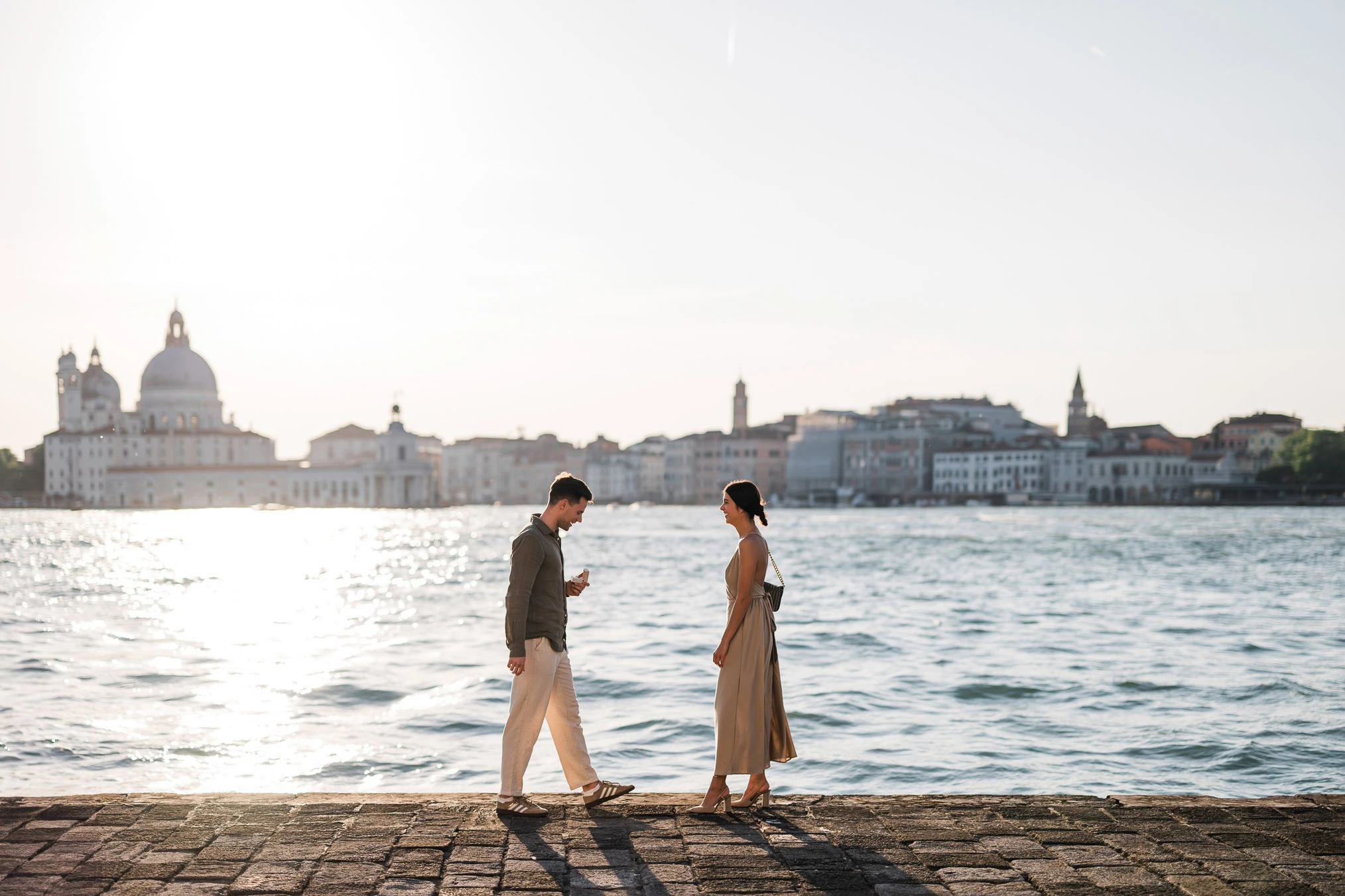Man proposing to his girlfriend at sunset on San Giorgio Maggiore island
